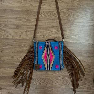 Western Saddle blanket crossbody bag with fringe.